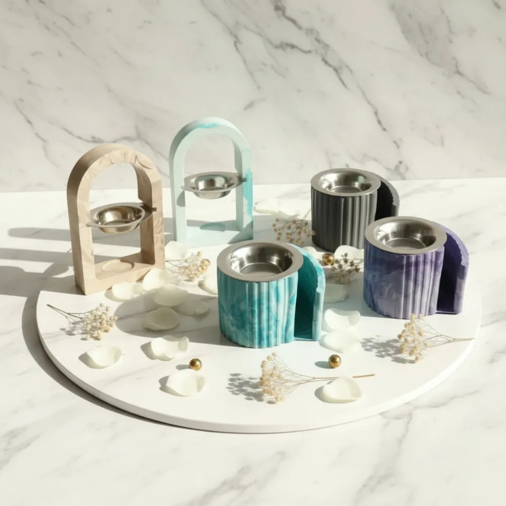 Collection de brûle-parfums artisanaux en jesmonite - modèles arche et escalier avec coupelle inox, coloris beige marbré, bleu, gris anthracite, turquoise et violet - Les Créations des A