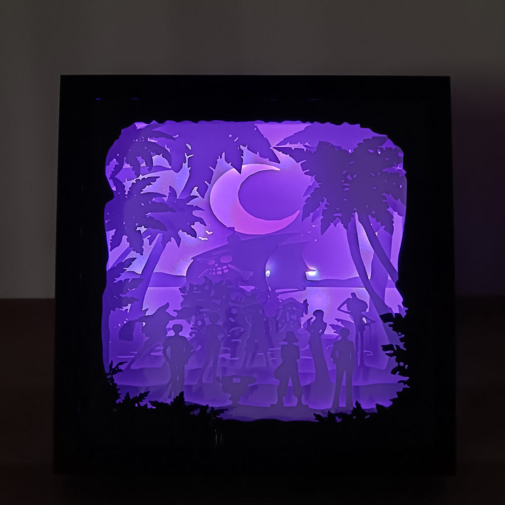 Shadow box lumineuse artisanale inspirée d'un univers de pirates. Décor multicouche représentant un équipage d'aventuriers, un grand navire et un paysage tropical avec éclairage LED - Les Créations des A